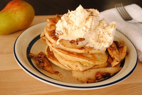 Buttermilk Pancakes with Caramelized Pears and Pecans topped with Whipped Vanilla Cream