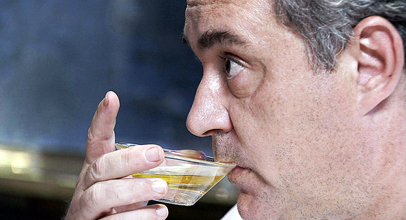 Ferran Adriá samples a cocktail.