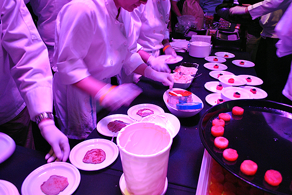 Chefs preparing hors d'oeuvres.