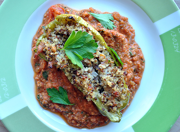Quinoa and Sausage Stuffed Peppers with Tomato Peanut Sauce