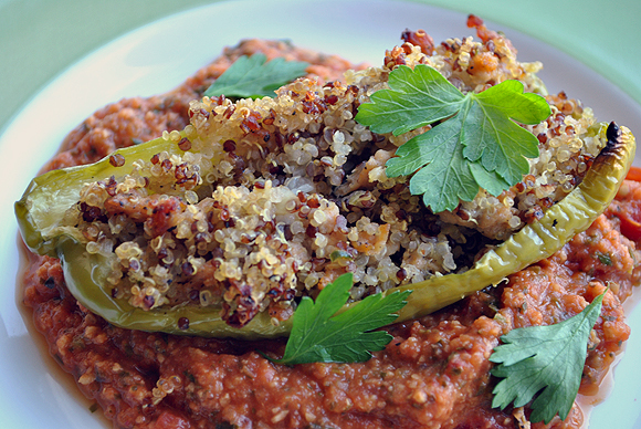 Stuffed Quinoa and Sausage Peppers with Tomato Peanut Sauce