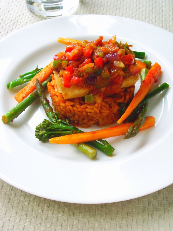 One pot aromatic Jollof rice, served with grilled chicken breast, covered with salsa style mixed sweet pepper sauce and steamed mixed vegetables.