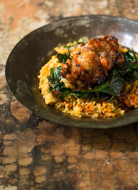 Chicken Thighs with Red Palm and Coconut Rice from "Senegal: Modern Senegalese Recipes from the Source to the Bow"l by Pierre Thiam with Jennifer Sit